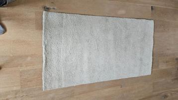 Beige rug; Vloerkleed 