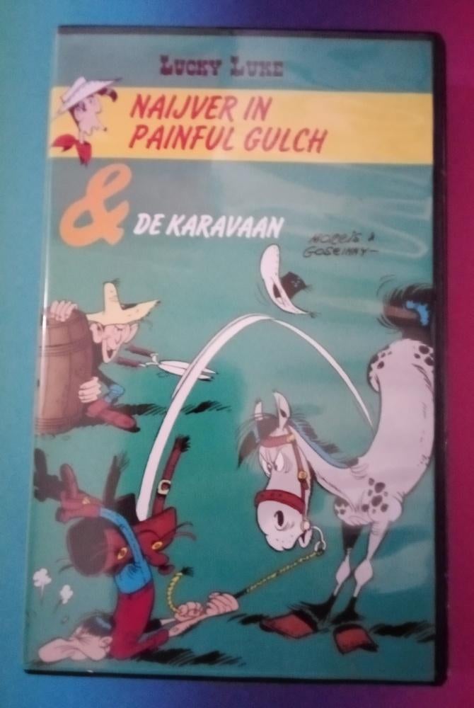 VHS - Lucky Luke en de Karavaan - Koopvideo, Cd's en Dvd's, VHS | Kinderen en Jeugd, Gebruikt, Tekenfilm, Verzenden, Alle leeftijden