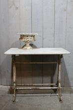 Gietijzeren tuintafel, Ophalen