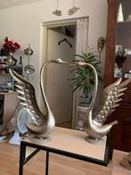2 metalen zwanen., Ophalen