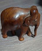 Kleine hout gesneede olifantje, Ophalen