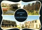 Groeten uit Lelystad - 4 afb - stadsgezichten - 1979? gelope, Verzamelen, Ansichtkaarten | Nederland, Ophalen of Verzenden, 1960 tot 1980