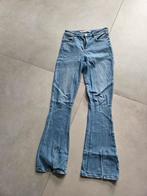 Flared pants spijkerbroek Raizzed met split, Kleding | Dames, Spijkerbroeken en Jeans, Blauw, Raizzed, Ophalen of Verzenden, Zo goed als nieuw