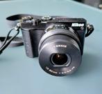 Nikon 1-J5  camera z.g.a.n. met 2 nikkor objectieven, Audio, Tv en Foto, Fotocamera's Digitaal, Ophalen of Verzenden, Zo goed als nieuw