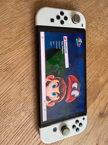 Nintendo Switch OLED – Zo goed als nieuw + accessoires