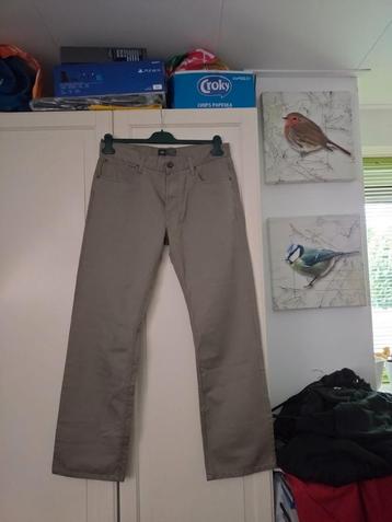 Mooie licht bruine  lange broek van WE  W34 / L32  beschikbaar voor biedingen
