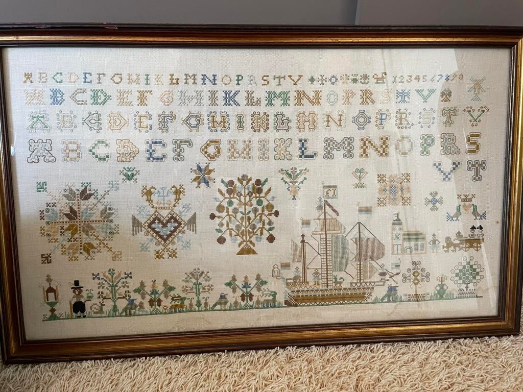 Oude geborduurde letterlap, Ophalen