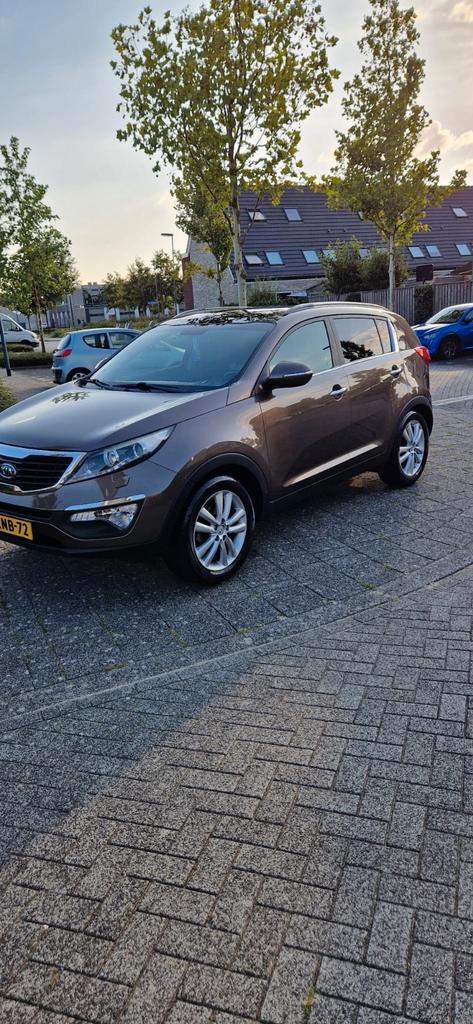 Kia Sportage 1.6 GDI 2WD 2010 Bruin, Auto's, Kia, Sportage, Achteruitrijcamera, Airbags, Airconditioning, Bluetooth, Centrale vergrendeling