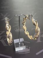 Nieuw goud. 14 karaat. Oorbellen. Wokkels. 6,5 x 1 cm. €2050, Ophalen of Verzenden, Nieuw, Goud