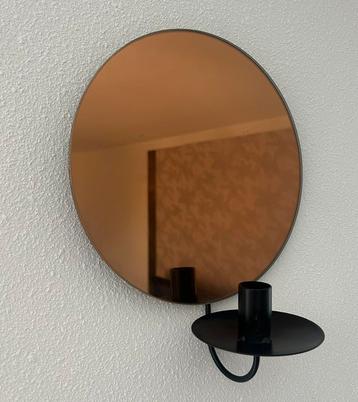 Koper ronde spiegel met zwarte kaarsenhouder beschikbaar voor biedingen