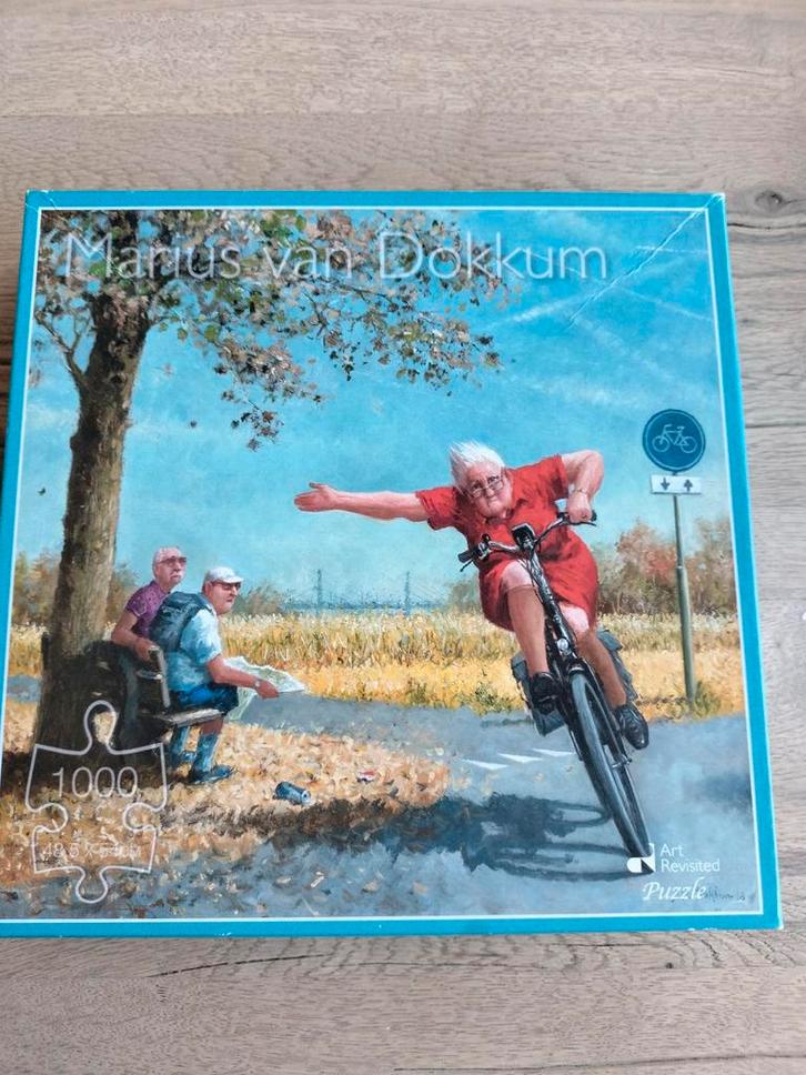 Marius van Dokkum Puzzel 1000 stukjes - Fietsende Dame, Hobby en Vrije tijd, Denksport en Puzzels, Ophalen of Verzenden