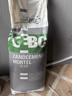 Dichte zak Zandcement, Ophalen