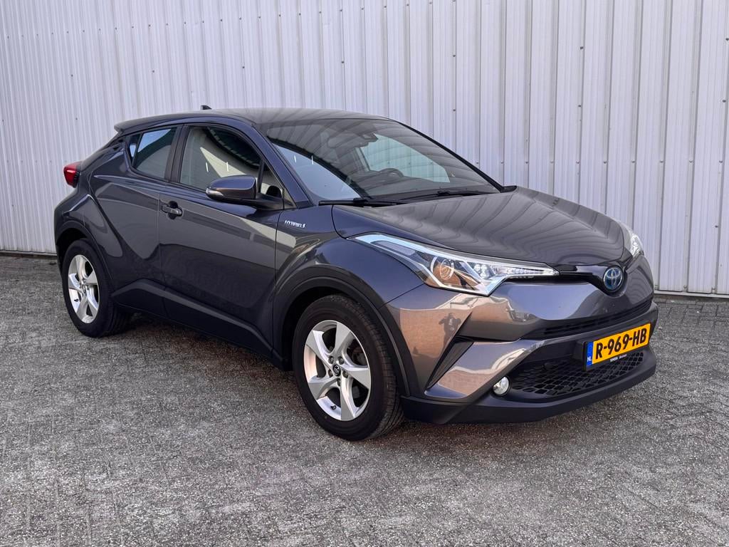 Toyota C-HR 1.8 Hybrid Active Clima / Cruise / Camera / 2019, Auto's, Toyota, Stof, 4 cilinders, 26 km/l, Hybride Elektrisch/Benzine