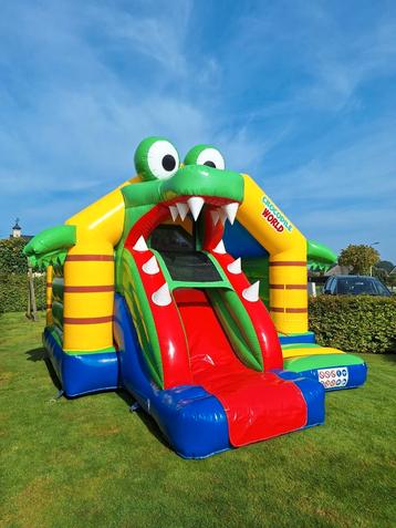 Springkussen "krokodil" met glijbaan te huur beschikbaar voor biedingen