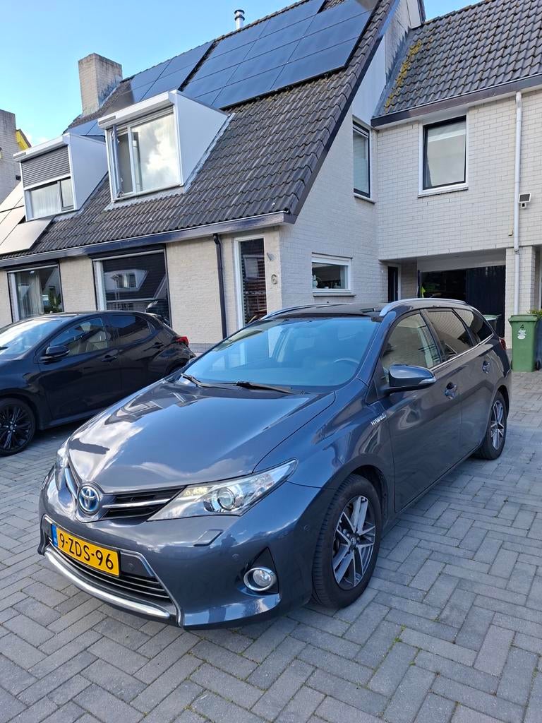 Toyota Auris 1.8 Hybrid Touring Sports CVT 2014 Blauw 200776, Auto's, Zwart, 345 kg, Blauw, 1798 cc