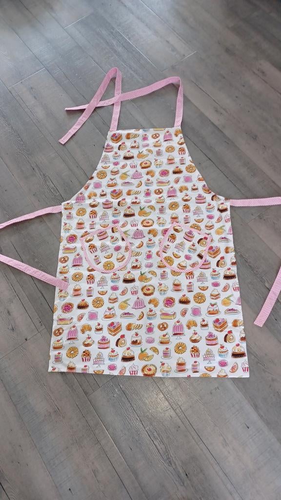 Schort Blond Amsterdam  Even bijkletsen, Huis en Inrichting, Keuken | Textiel, Ophalen of Verzenden, Nieuw, Roze, Schort