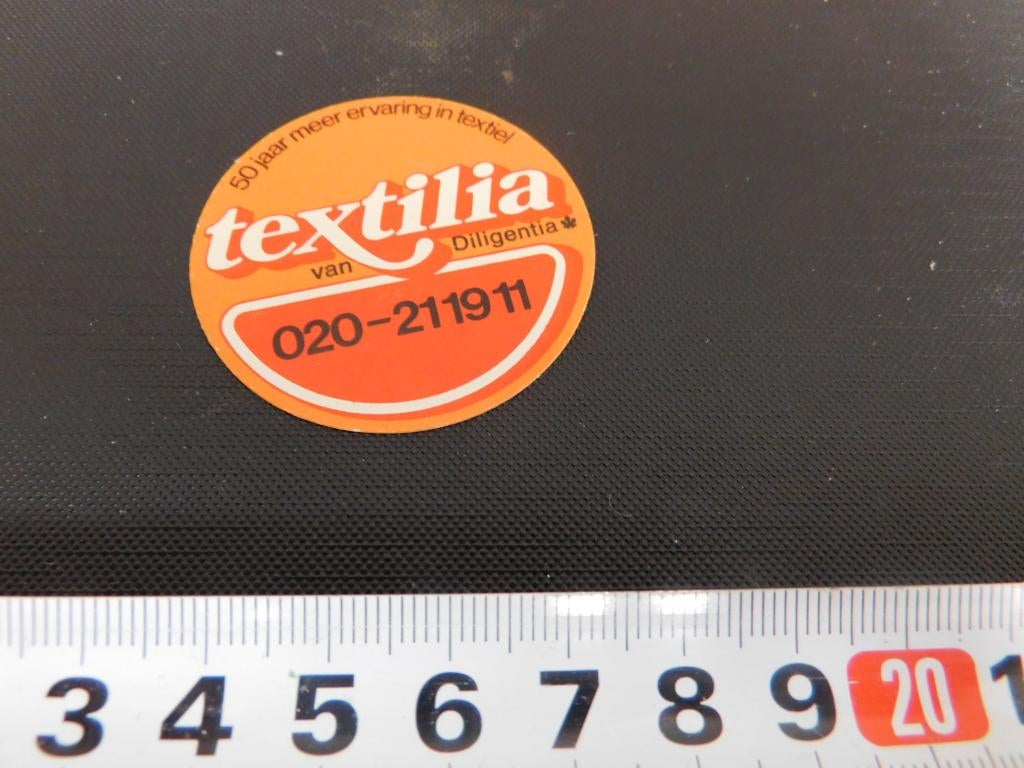 sticker textilia van diligentia 50 jr meer ervaring textiel, Ophalen, Zo goed als nieuw