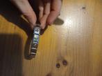 D'linQ armband met Bedels, Gebruikt, Staal, Ophalen of Verzenden, Met bedels of kralen