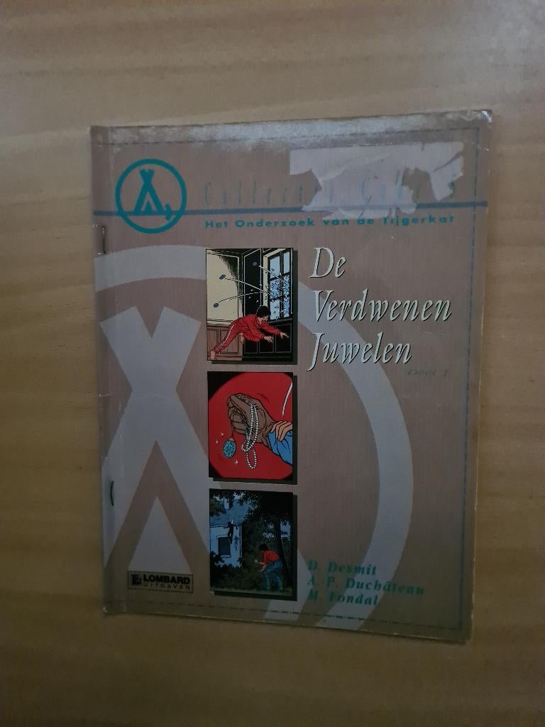 Het onderzoek van de tijgerkat.       De verdwenen juwelen, Eén stripboek, Ophalen of Verzenden, Gelezen, D. Desmit