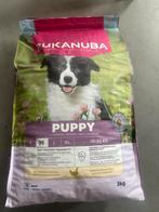 Nieuwe zak Eukanuba puppyvoer, Ophalen