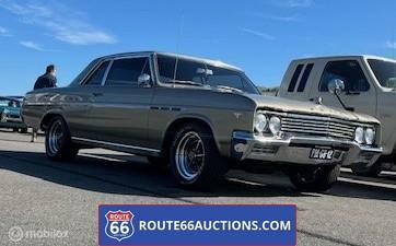 Buick Skylark Coupe 1965 | Route 66 auctions, Auto's, Oldtimers, Bedrijf, Te koop, Buick, Benzine, Coupé, Automaat, Bruin, Achterwielaandrijving