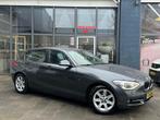 BMW 1-serie 114i Business+ | Airco | Cruise | Navi | Camera, 1-Serie, Achterwielaandrijving, Gebruikt, 4 cilinders