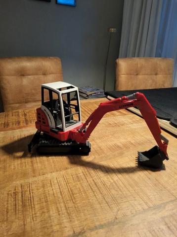 Mini Bruder Schaeff HR 16 Graafmachine beschikbaar voor biedingen