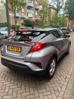 Toyota C-HR 1.8 Hybrid 122pk CVT 2019 Grijs, Auto's, 4 cilinders, 98 pk, SUV of Terreinwagen, 1395 kg
