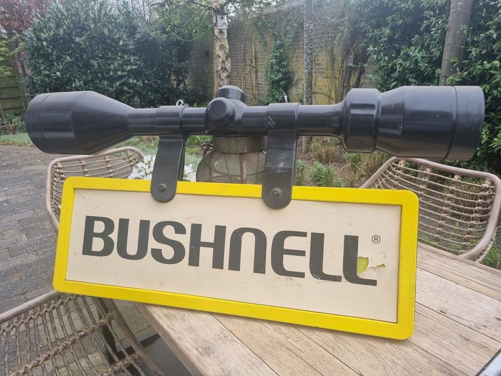 Zeldzame Vintage Bushnell Winkel reclame, Ophalen of Verzenden, Gebruikt, Reclamebord