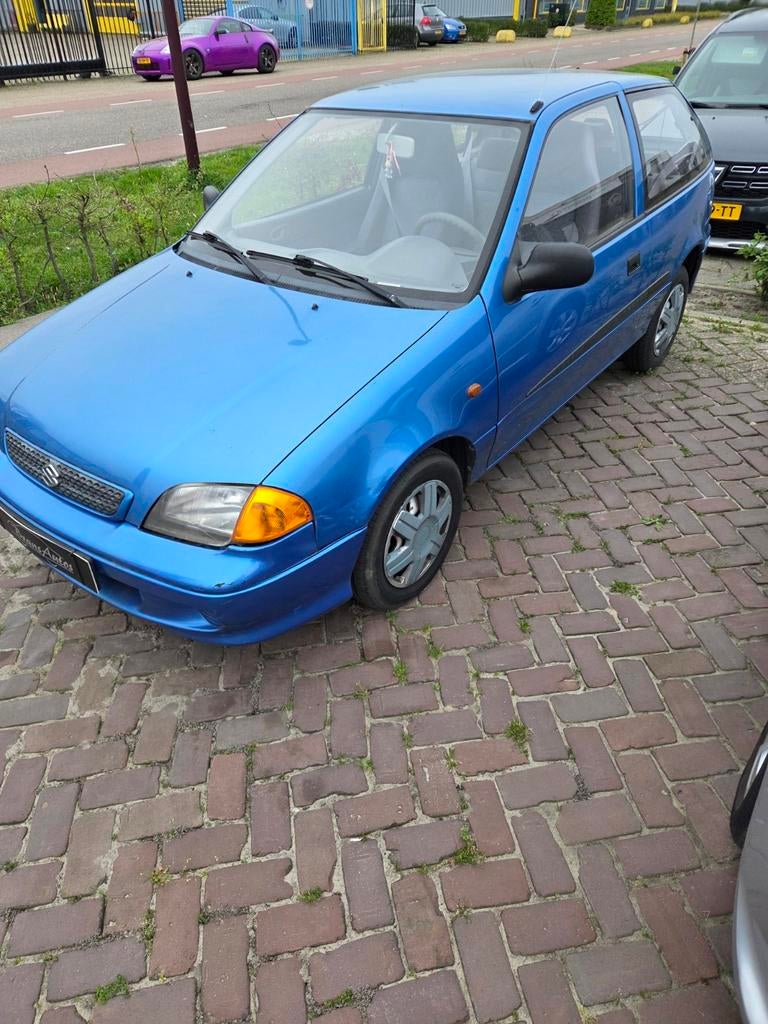 Suzuki Swift 1.3 AUT 2002 Blauw, Auto's, Suzuki, Stof, 785 kg, 4 cilinders, Blauw