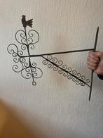 Antiek gietijzeren hanger, Ophalen