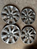 Wieldoppen 15 inch en origineel van Peugeot 208, Auto diversen, Wieldoppen, Ophalen, Gebruikt