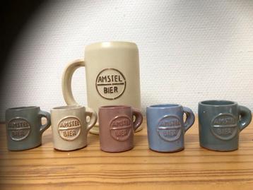 reeks vintage Amstel bierpullen. 4,5 cm en 13cm beschikbaar voor biedingen