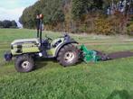 minitrekker met overtopfrees en chauffeur, Ophalen, Tuinaarde