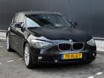 BMW 1-serie 118i Business AUTOMAAT 5-DEURS NAVI/PDC/CRUISE |, Gebruikt, Zwart, 4 cilinders, 1290 kg