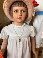 2 oude paspopjes, Ophalen