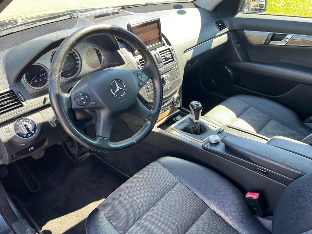 Mercedes-Benz C-Klasse C180 Kompr. Sedan 2009 Half Leer, Leder en Stof, Handgeschakeld, Parkeersensor, Sedan