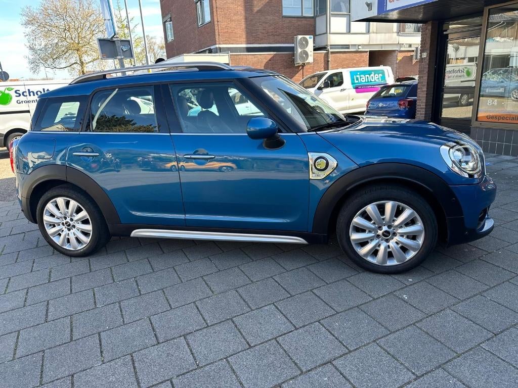 Mini Countryman 1.5 Cooper SE All4 Chili Hybride Ned. auto, Auto's, 136 pk, Zwart, Countryman, Blauw