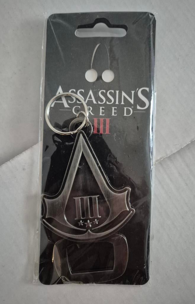 Assassins Creed III sleutelhanger/flesopener (NIEUW), Ophalen of Verzenden, Nieuw, Overige typen