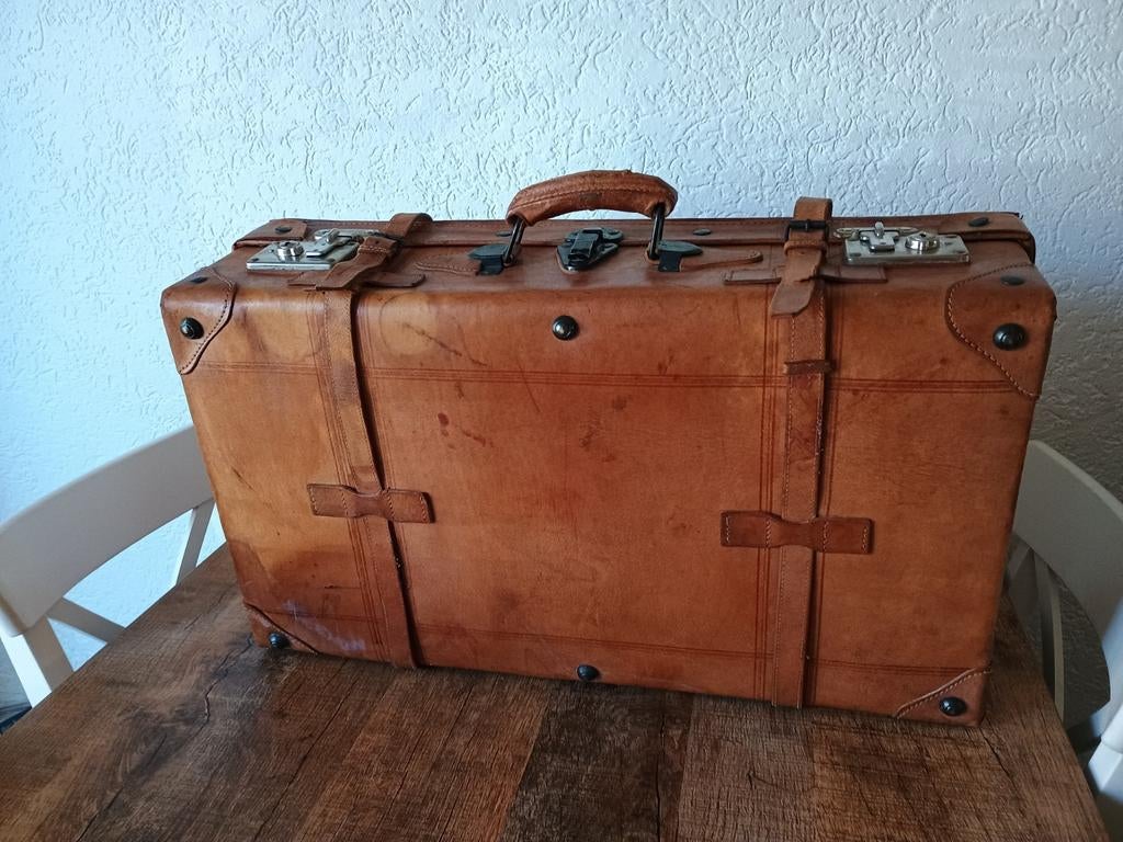 Oude brocante leren koffer, Ophalen