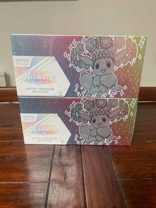 Pokémon Prismatic Evolutions Super Premium Collection SPC, Hobby en Vrije tijd, Verzamelkaartspellen | Pokémon, Nieuw, Boosterbox