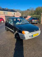Toyota Starlet 1.3 16V 1998 Zwart *NIEUWE APK*, Auto's, 4 cilinders, Starlet, 400 kg, Zwart