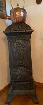 Oude Art Nouveau gietijzeren kachel, Ophalen