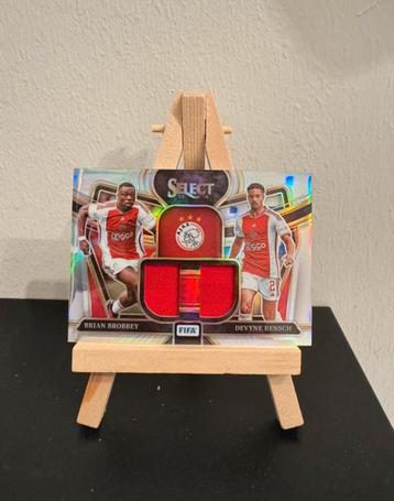 23/24 Panini Select Fifa - Brobbey/Rensch Dual Swatch Patch beschikbaar voor biedingen
