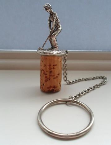 Metalen Flessenstopper met afbeelding golfer. beschikbaar voor biedingen
