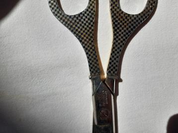brievenopener en (coupon)schaar ooit van de Twentse bank beschikbaar voor biedingen