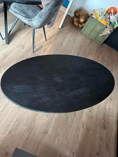 Zwarte salontafel mangohout met kruispoot Cavino ovaal, Huis en Inrichting, Tafels | Salontafels, Gebruikt, Minder dan 50 cm, 50 tot 100 cm