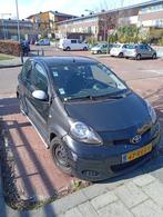 Toyota Aygo 1.0 12V Vvt-i 5DRS 2011 Zwart, Auto's, Voorwielaandrijving, Euro 5, Stof, Centrale vergrendeling