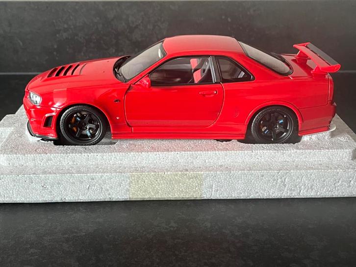 Nissan Skyline GT-R (R34) rood 1:18 Motorhelix, Hobby en Vrije tijd, Modelauto's | 1:18, Nieuw, Auto, Overige merken, Ophalen of Verzenden