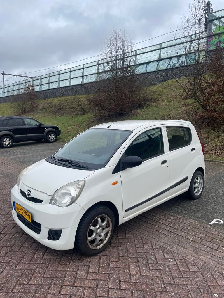 Daihatsu Cuore 1.0 5D 2009 Wit, Auto's, Daihatsu, Voorwielaandrijving, 600 kg, 18 €/maand, 4 stoelen